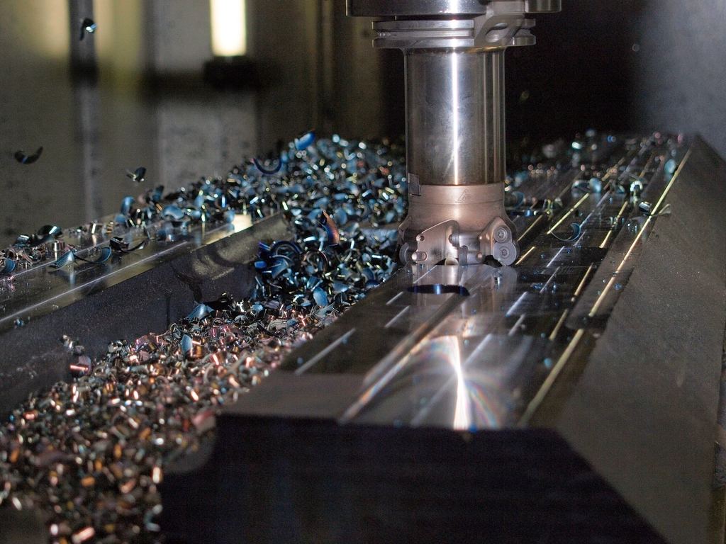 A CNC mill cutting metal